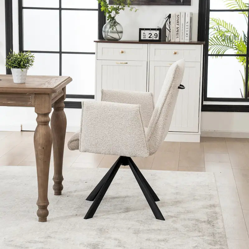 Fauteuil pivotant rembourré avec dossier haut et accoudoirs ouverts